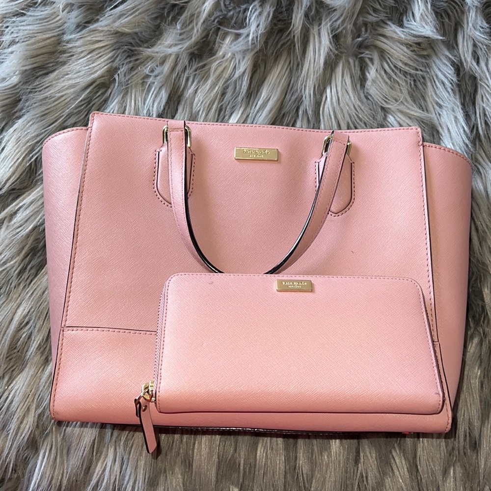 Pink Kate spade shoulder bag and wallet.